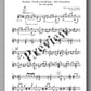 Sheet music for guitar with decorative text overlay