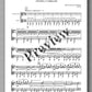 Sheet music with musical notation and text on a white background